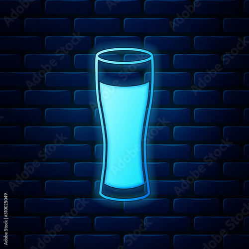 Glowing neon Glass of beer icon isolated on brick wall background. Vector Illustration