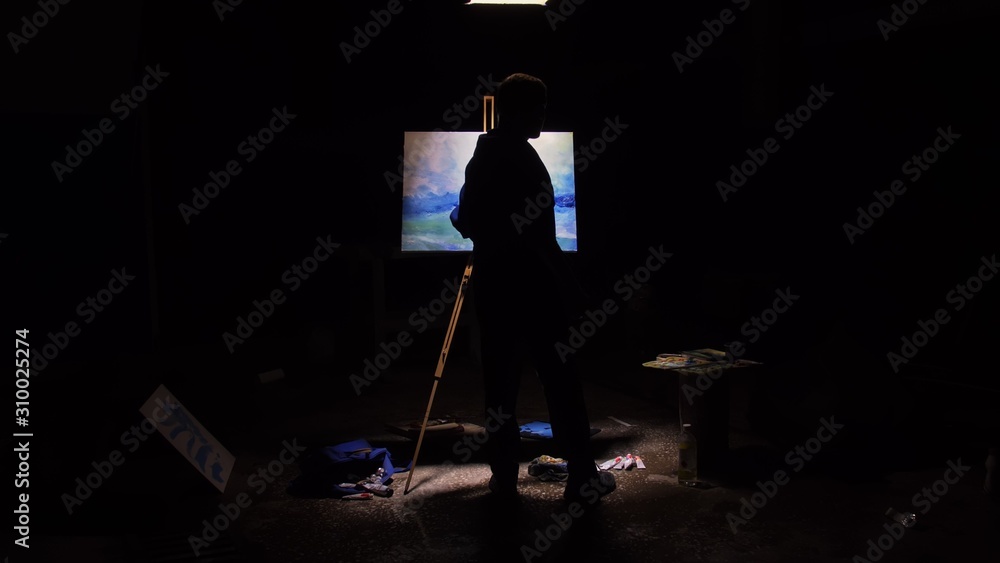 Artist copyist paint seascape with ship in ocean. Craftsman decorator draw as boat sail on blue sea with acrylic oil color. Black background. Indoor. Wide angle shot cinematic look. Artist copyist paint seascape with ship in ocean. Craftsman decorator draw as boat sail on blue sea with acrylic oil color. Black background. Indoor. Wide angle shot cinematic look.