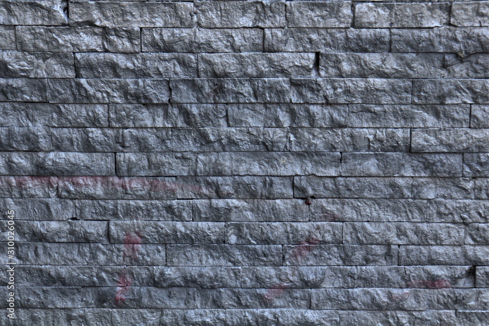 Masonry, black stone of rectangular shape. Masonry, black stone of rectangular shape.