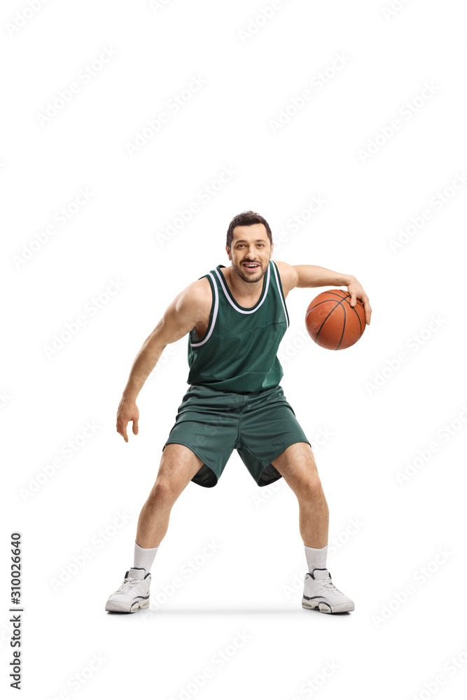 Man in green jersey playing basketball Man in green jersey playing basketball