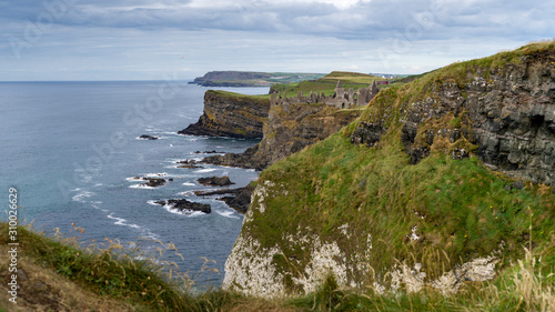 Ruins of medieval Dunluce Castle on the cliff, County Antrim, Northern Ireland, Ireland