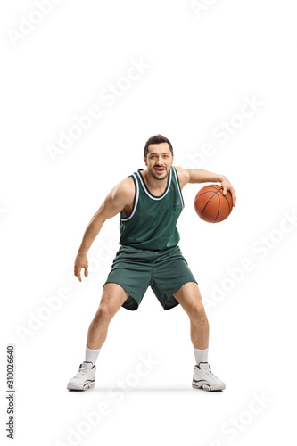 Man in green jersey playing basketball © Ljupco Smokovski