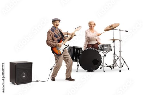 Fotografia Elderly woman playing drums and man playing an electric guitar