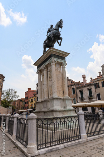 VENICE, ITALY - NOVEMBER 04, 2013: The equestrian statue (1488) of Bartolomeo Colleoni by Verrocchio in Venice. Campo Santi Giovanni e Paolo a Venezia opposite La Scuola Grande di San Marco