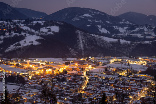 city ​​lights from the mountain. winter season. Alpi Orobie. The Seriana valley Bergamo Italy. photo