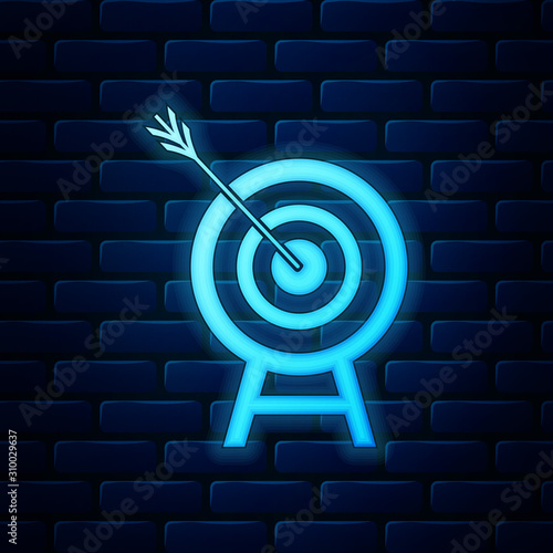 Glowing neon Target with arrow icon isolated on brick wall background. Dart board sign. Archery board icon. Dartboard sign. Business goal concept. Vector Illustration