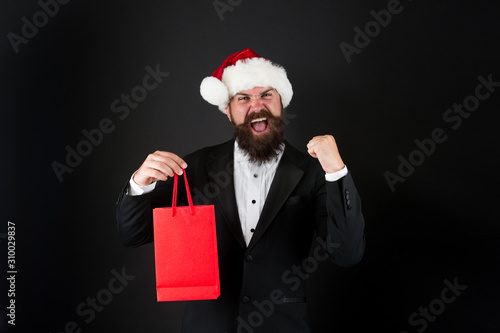 Just in time for boxing day. Happy manager hold paperbag with winner gesture. Bearded man celebrate boxing day. New year. Merry Christmas. Boxing day sale. Most wanted gift for Boxing day, copy space