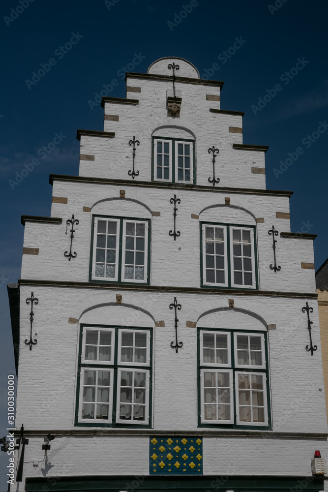 historic crow-stepped gable facade in the Dutch old town of Friedrichstadt