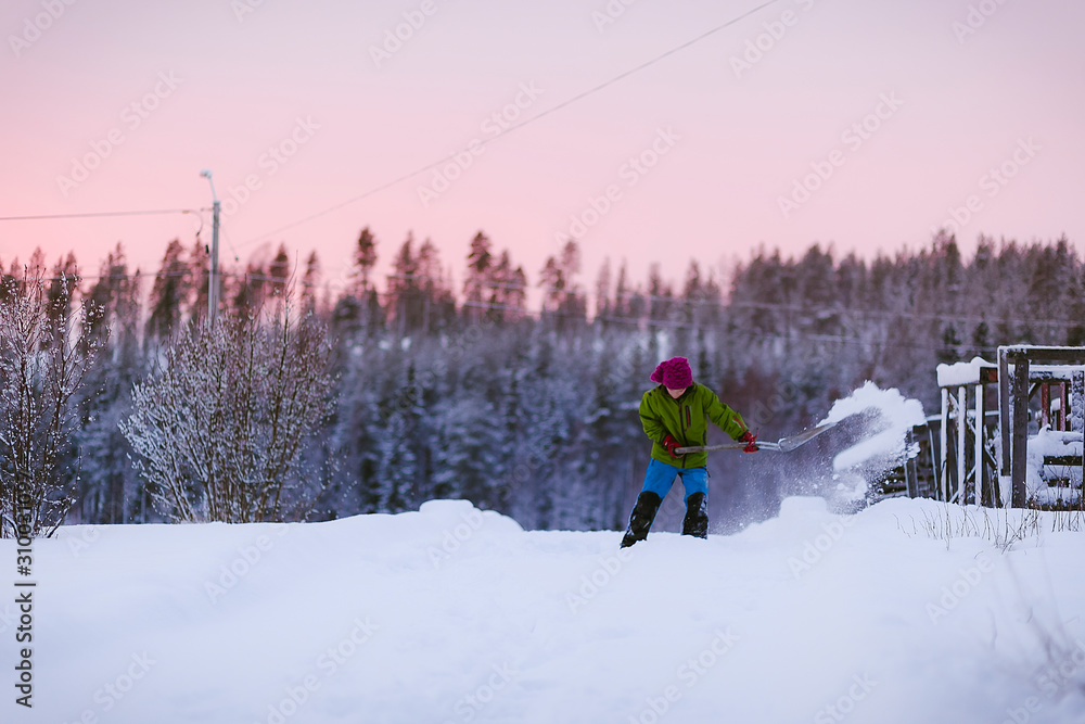 Girl digging in snow Girl digging in snow