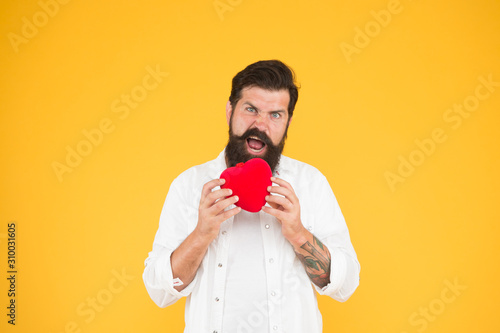 Heart disease. Healthy habits and lifestyle. Monitoring and measuring. Man bearded hipster hold red heart. Prescribe medication lower blood pressure cholesterol. Feel pulse check heart rate rhythm