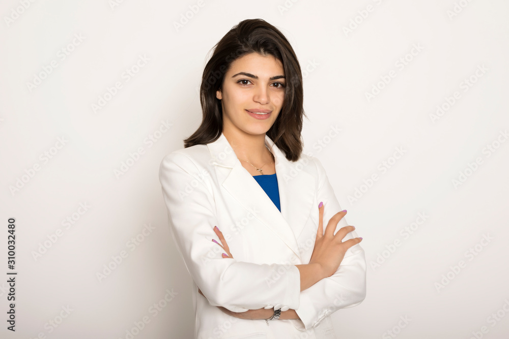 Portrait of young beautiful business woman on white background.