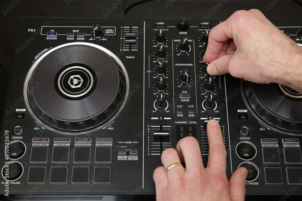 hand of dj in action. Music background, banner, card. Close-up. Stock Photo  | Adobe Stock