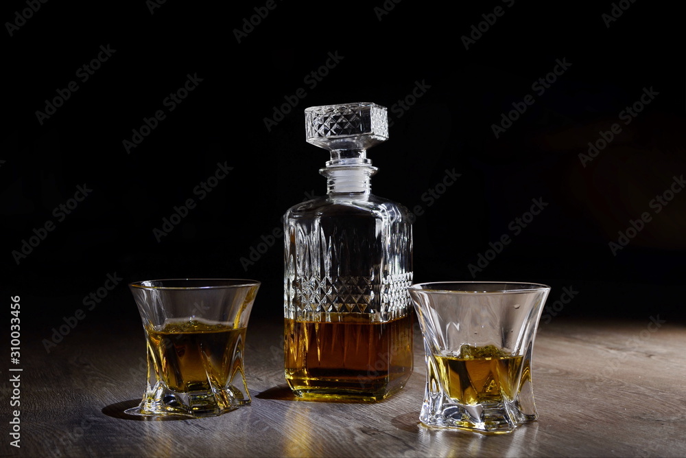 bottle of whiskey with two glasses bottle of whiskey with two glasses