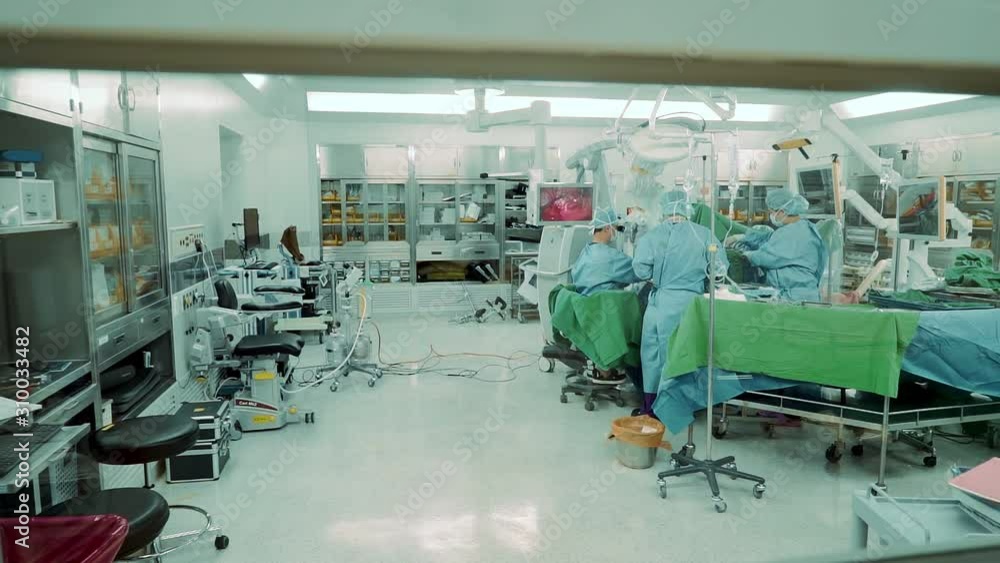 Operating room with doctors with a view through the window in the doors Operating room with doctors with a view through the window in the doors