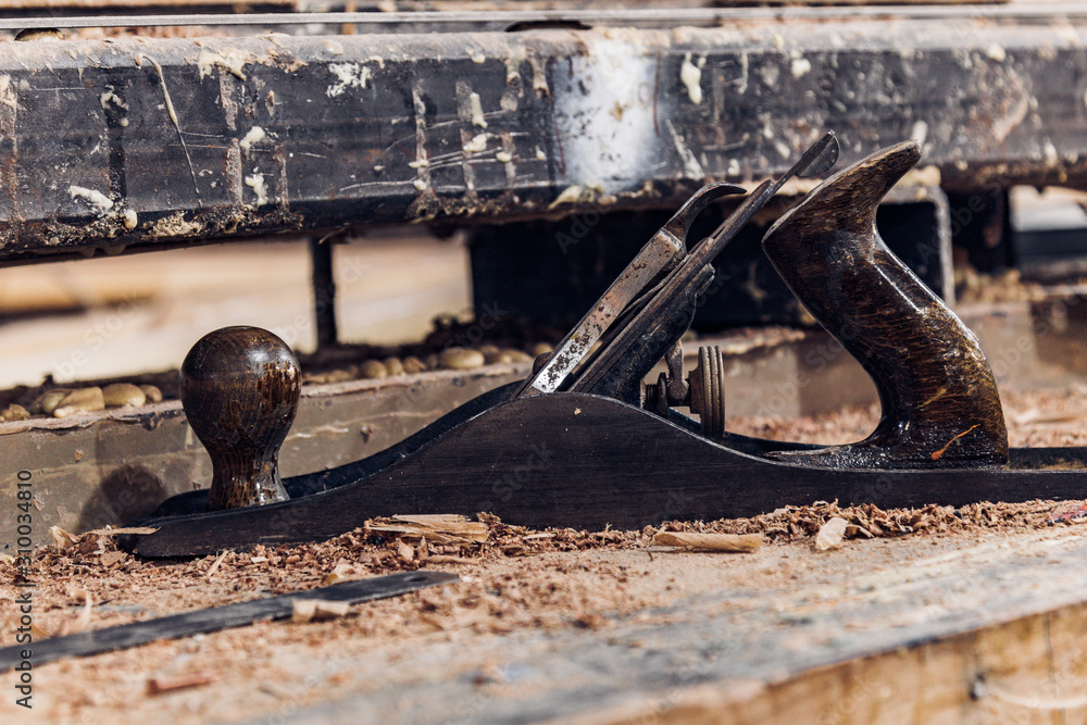Traditional plane tool in a woodworking workshop Traditional plane tool in a woodworking workshop