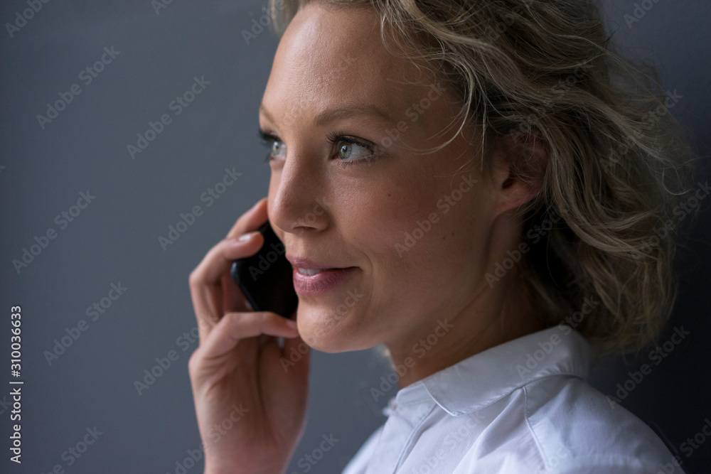 Portrait of smiling young businesswoman on the phone Portrait of smiling young businesswoman on the phone