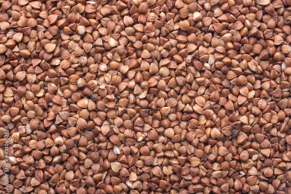 Photo food buckwheat groats. Texture background grain buckwheat groats. Photo food buckwheat groats. Texture background grain buckwheat groats.