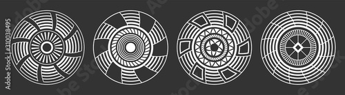 Set of four abstract circular ornaments. Decorative patterns isolated on black background.