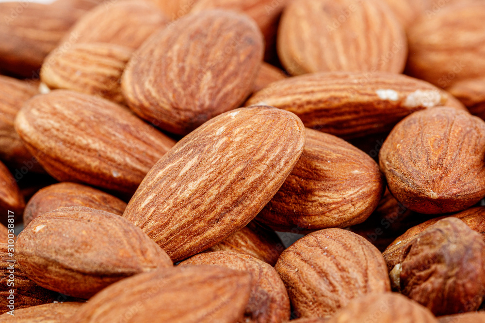 macro almond nuts on a white background macro almond nuts on a white background