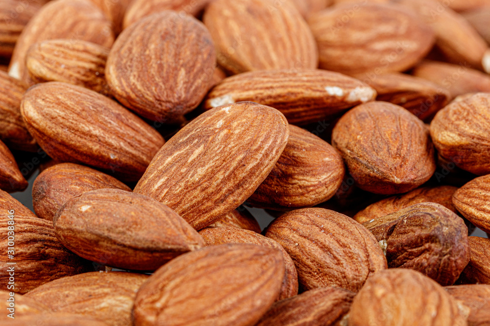 macro almond nuts on a white background macro almond nuts on a white background