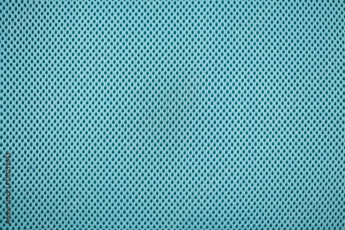 Close up of teal blue colored mesh textile fabric photo