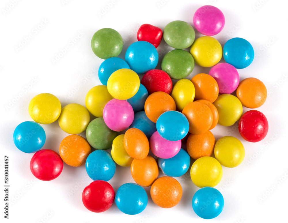 colored round candies on a white background colored round candies on a white background