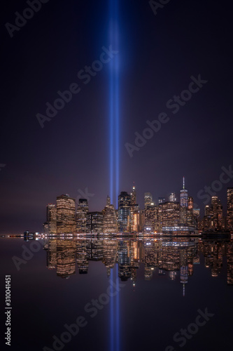USA, New York, New York City, Manhattan skyline with Tribute in Light at night photo