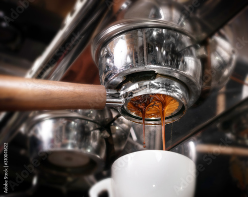 Making espresso coffee in coffeeshop or cafe closeup