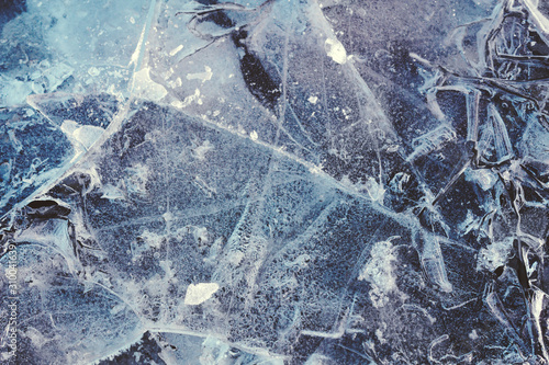 Germany, North Rhine-Westphalia, Wuppertal, Close-up of cracked ice in winter photo