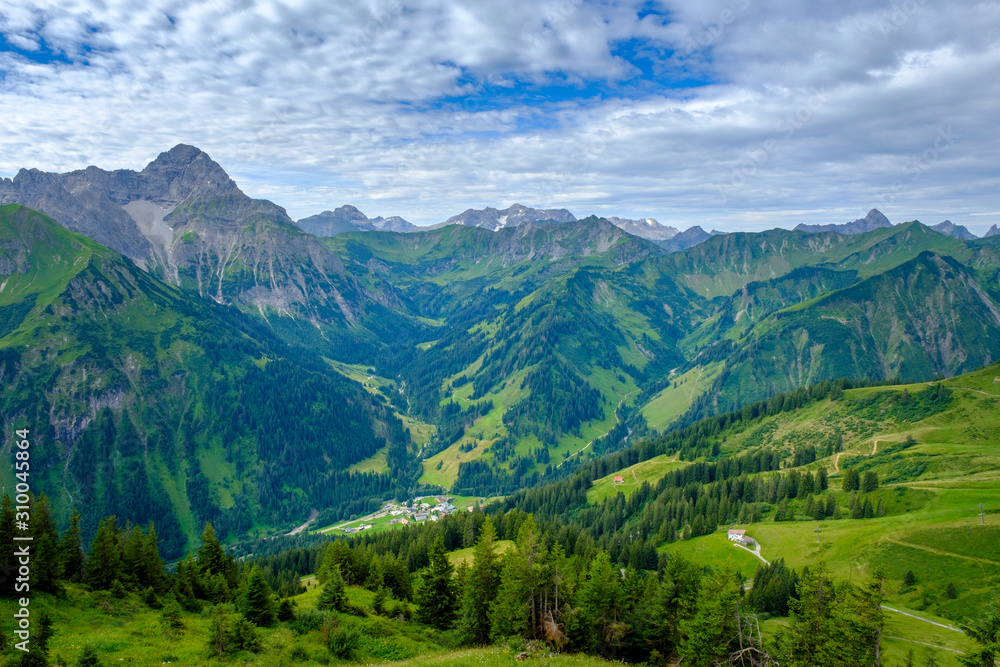 Austria, Vorarlberg, Mittelberg, Green scenic valley seen from top of Walmendinger Horn mountain Austria, Vorarlberg, Mittelberg, Green scenic valley seen from top of Walmendinger Horn mountain