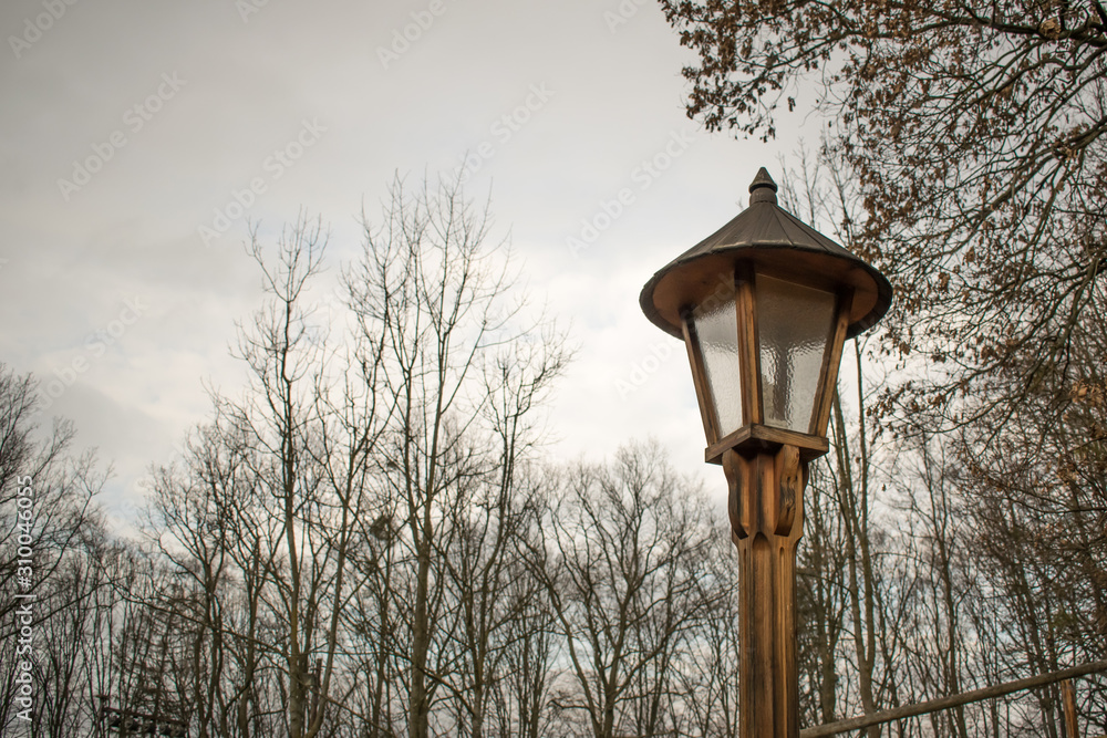 old wooden lamp light village closeup sky antient interesting unusuall old wooden lamp light village closeup sky antient interesting unusuall