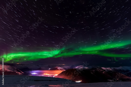 Fototapeta Naklejka Na Ścianę i Meble -  Aurora borealis in night northern sky. Ionization of air particles in the upper atmosphere.
