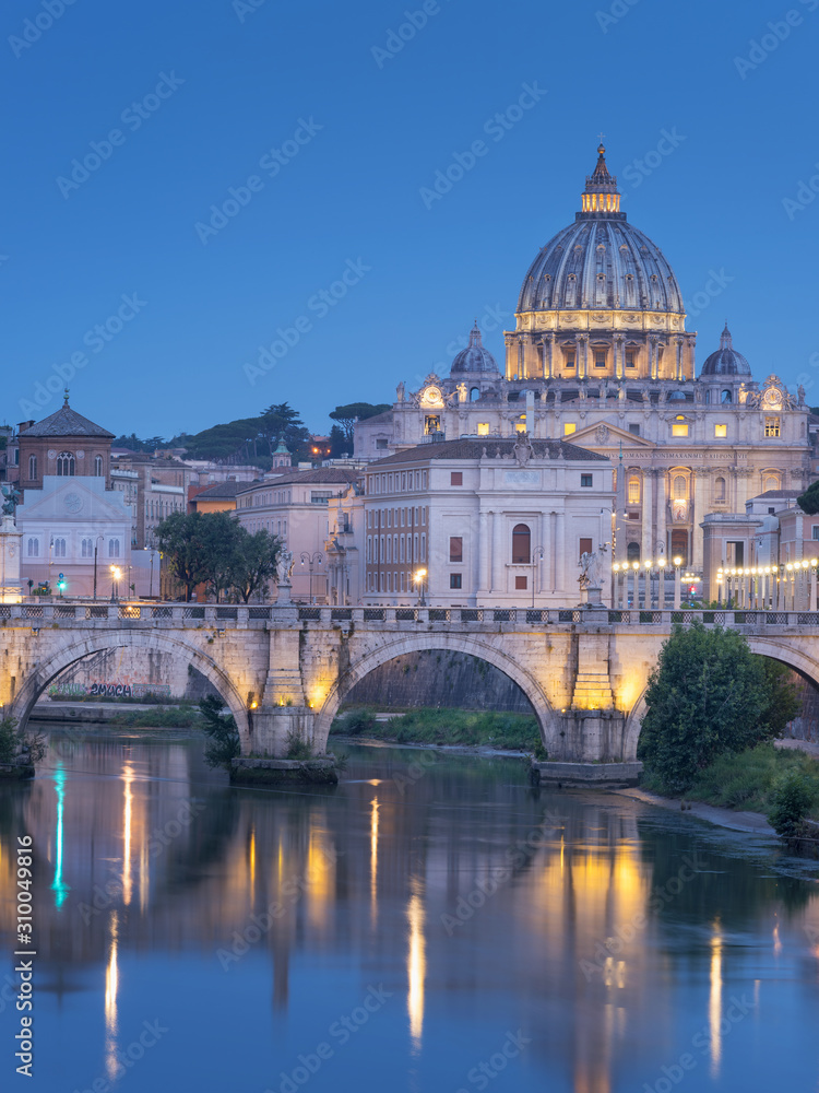 view to St Peter Cathedral and part of bridge in twilight in Rome in Italy