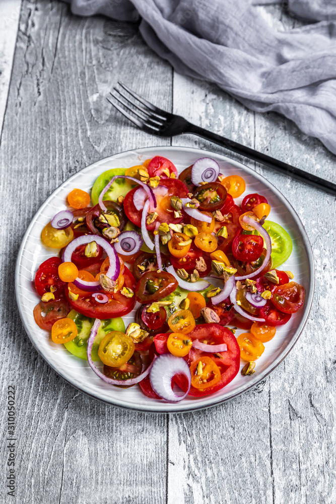 Tomato salad with red onion and pistachios Tomato salad with red onion and pistachios