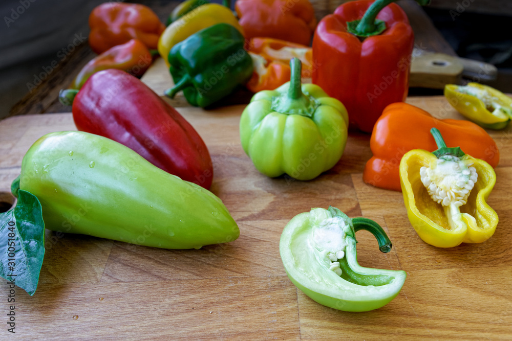 sliced bell peppers on wooden background sliced bell peppers on wooden background