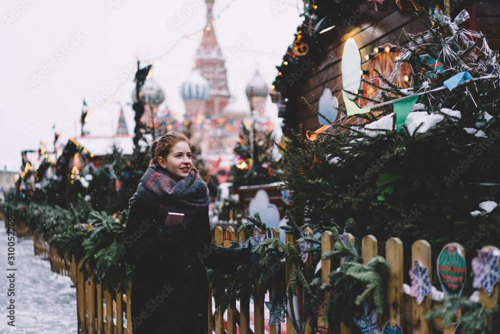 Woman walking on Red Square decorated for New Year