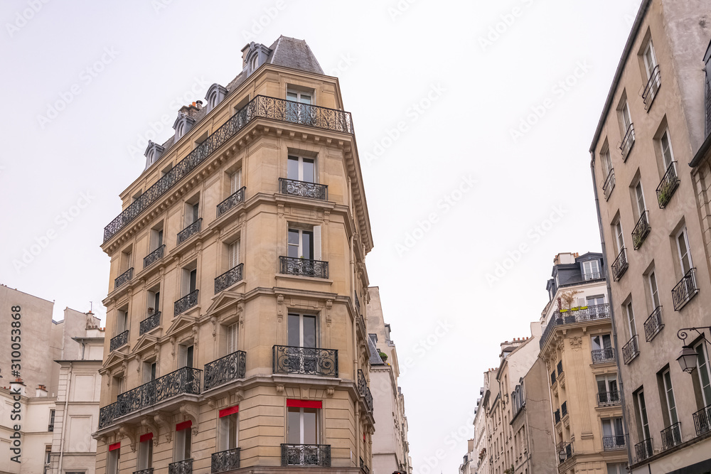 Fototapeta premium Paris, typical building, parisian facade and windows rue du Temple