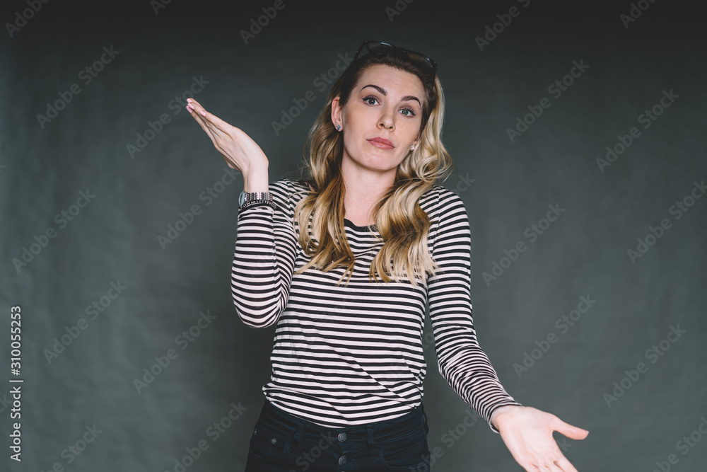 Confused young beautiful woman posing in studio Confused young beautiful woman posing in studio