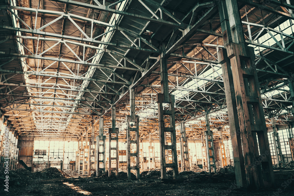Abandoned industrial creepy warehouse inside old grunge factory building, yellow vintage toned Abandoned industrial creepy warehouse inside old grunge factory building, yellow vintage toned