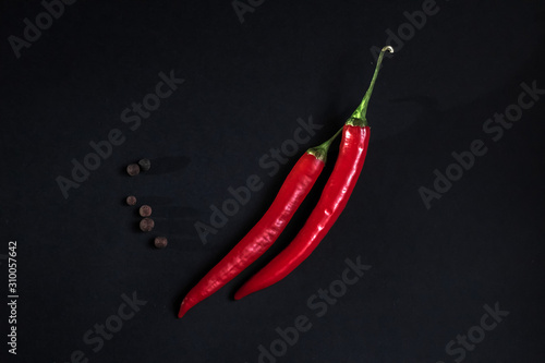 red chili pepper on a dark background.