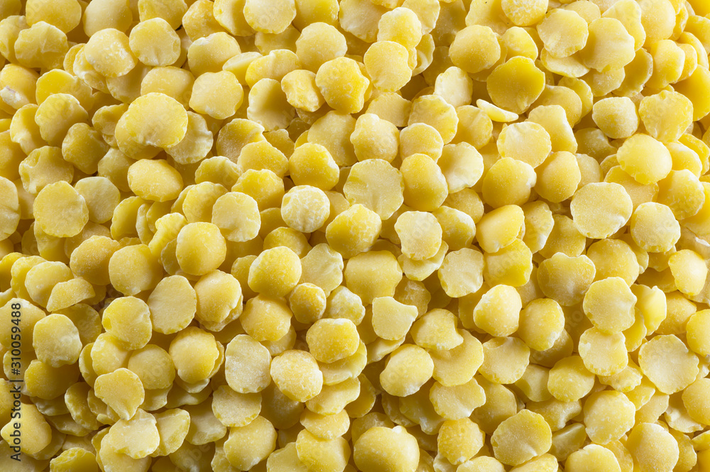 Uncooked raw yellow lentil texture background, heap of legume lentil concept (Lens culinaris) Uncooked raw yellow lentil texture background, heap of legume lentil concept (Lens culinaris)