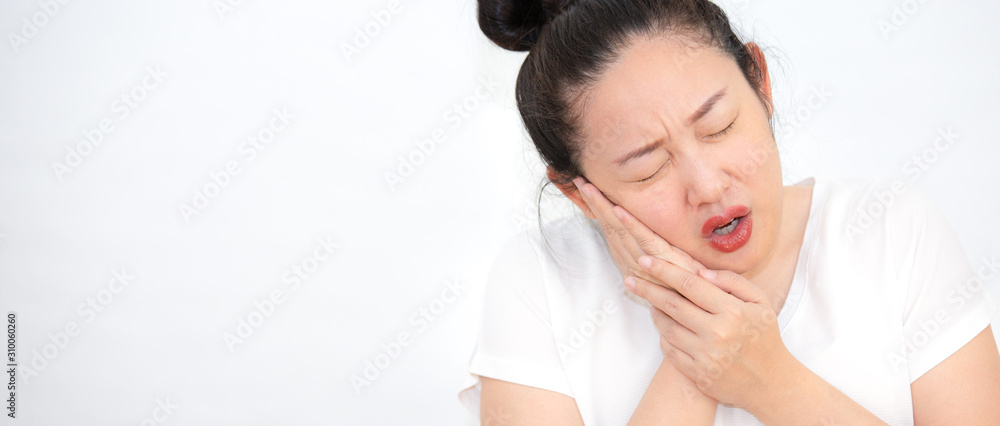 A picture of a woman with a toothache, putting a hand on her cheek, pain, having dental health problems and looking after the dentist. A picture of a woman with a toothache, putting a hand on her cheek, pain, having dental health problems and looking after the dentist.