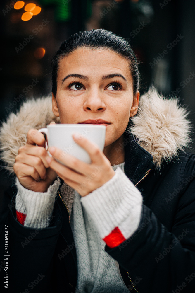 Woman drinking coffee in winter Woman drinking coffee in winter