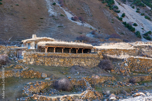 Distant view of old abandoned balkar village in North Caucasus photo