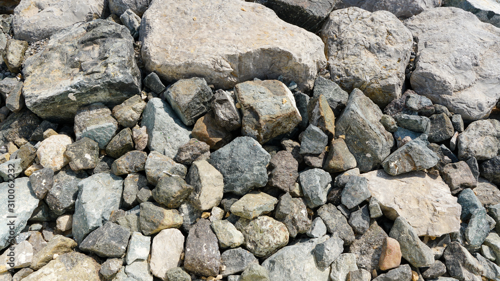 Close up to stones and rocks grey color shot at the bright day Close up to stones and rocks grey color shot at the bright day