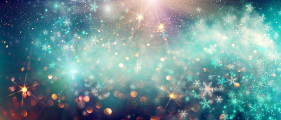 Winter Christmas and New Year glittering snow flakes swirl bokeh background, backdrop with sparkling blue stars, holiday garland, magic glowing stars, lights. Abstract Glitter Blinking sparks