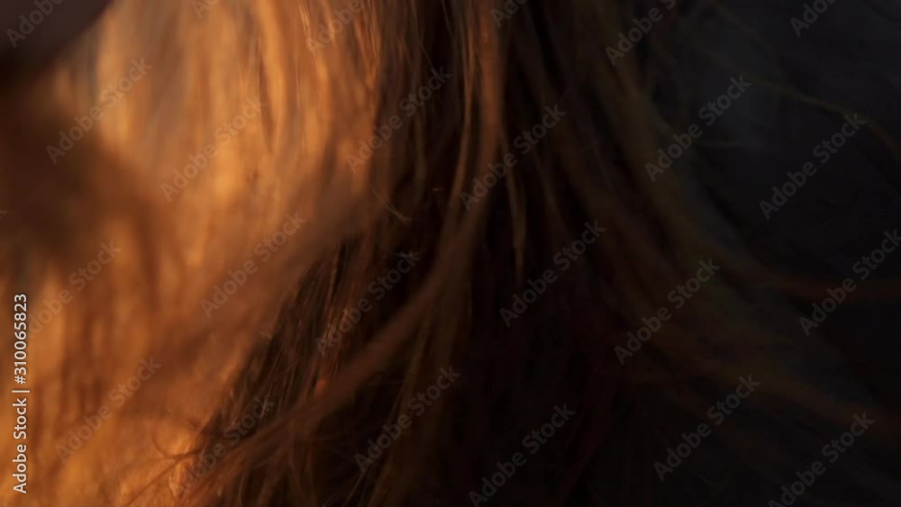 Cropped shot of girl is shaking long straight hair Cropped shot of girl is shaking long straight hair