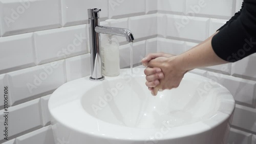 washing hands in a sink