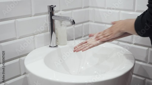 washing hands in a sink