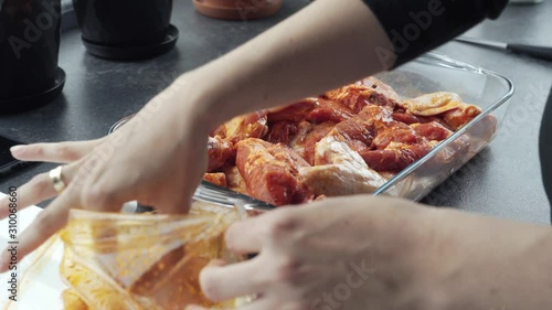 putting chicken in a roasting dish